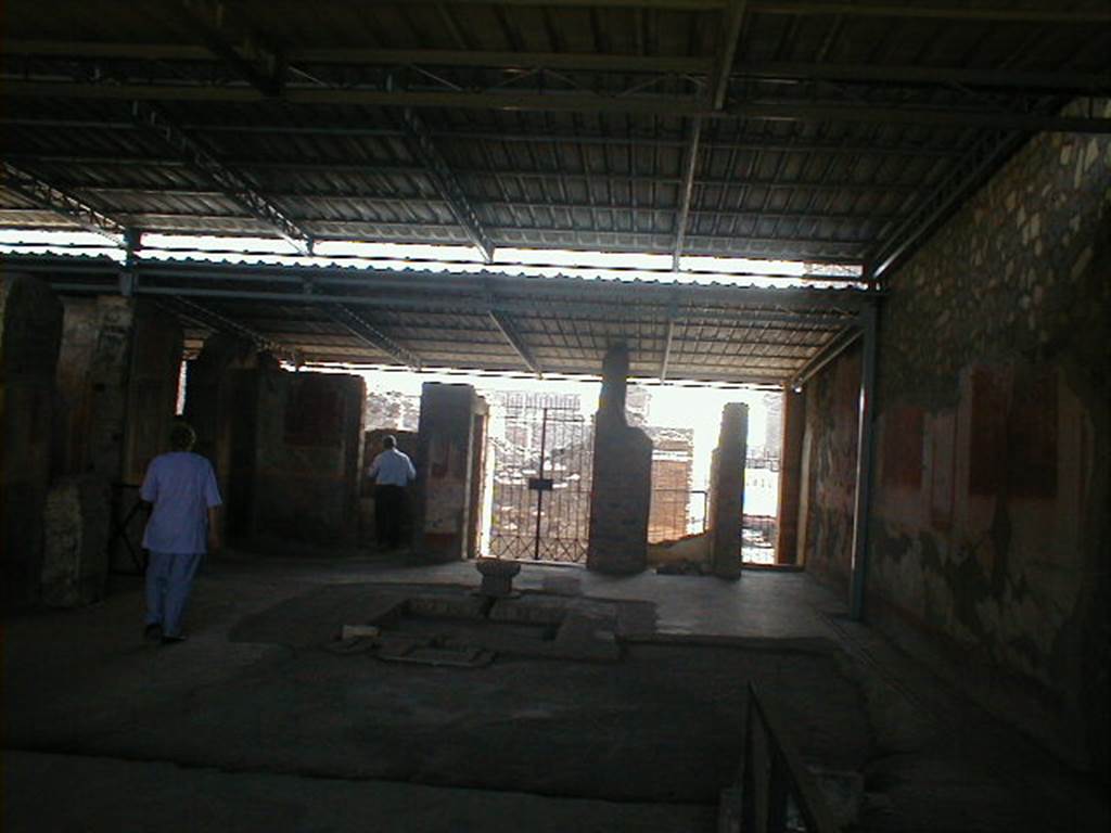 VI.17.42 Pompeii. September 2004.  Looking east across atrium 4 to doorways of room 5 and entrances VI.17.42, VI.17.43 and VI.17.44.