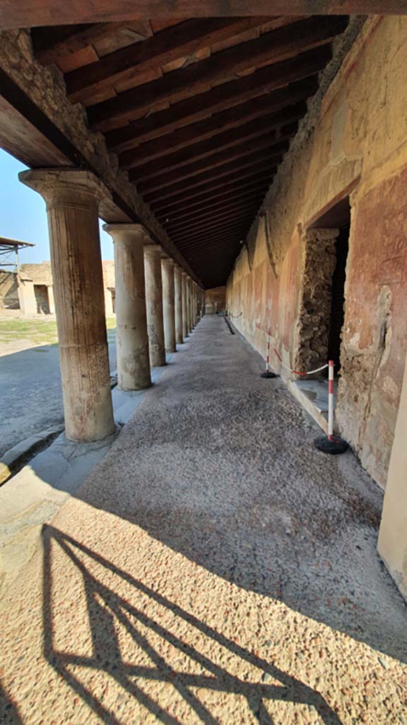 VII.1.8 Pompeii. July 2021. 
Looking north along east side of Portico B.
The entrance doorway into Men’s changing room and Baths is on right.
Foto Annette Haug, ERC Grant 681269 DÉCOR


