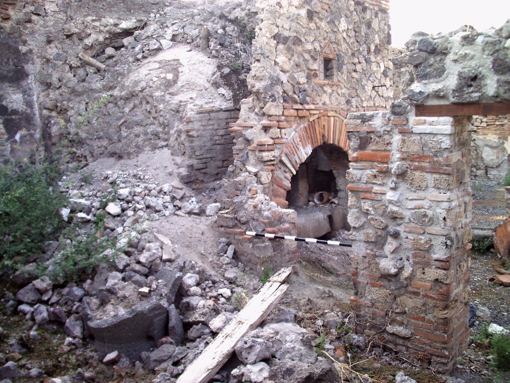 VII.1.36 Pompeii. August 2008.  Looking north-west towards oven from room on south side. Photo courtesy of Jared Benton.