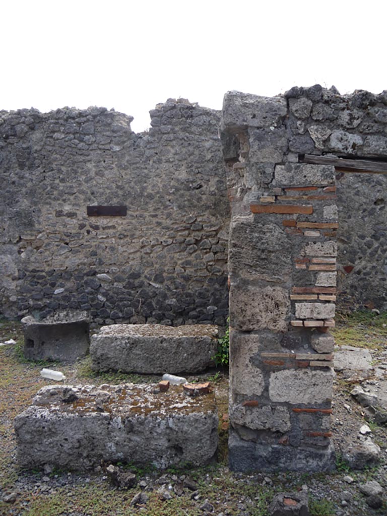 VII.1.36 Pompeii. October 2009. 
Looking south towards pilaster dividing two rooms on south side of oven. Photo courtesy of Jared Benton.
