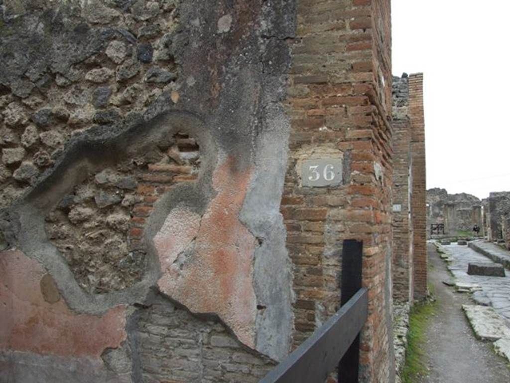 VII.1.36 Pompeii. December 2007. West side of entrance fauces and looking west along Via degli Augustali.
