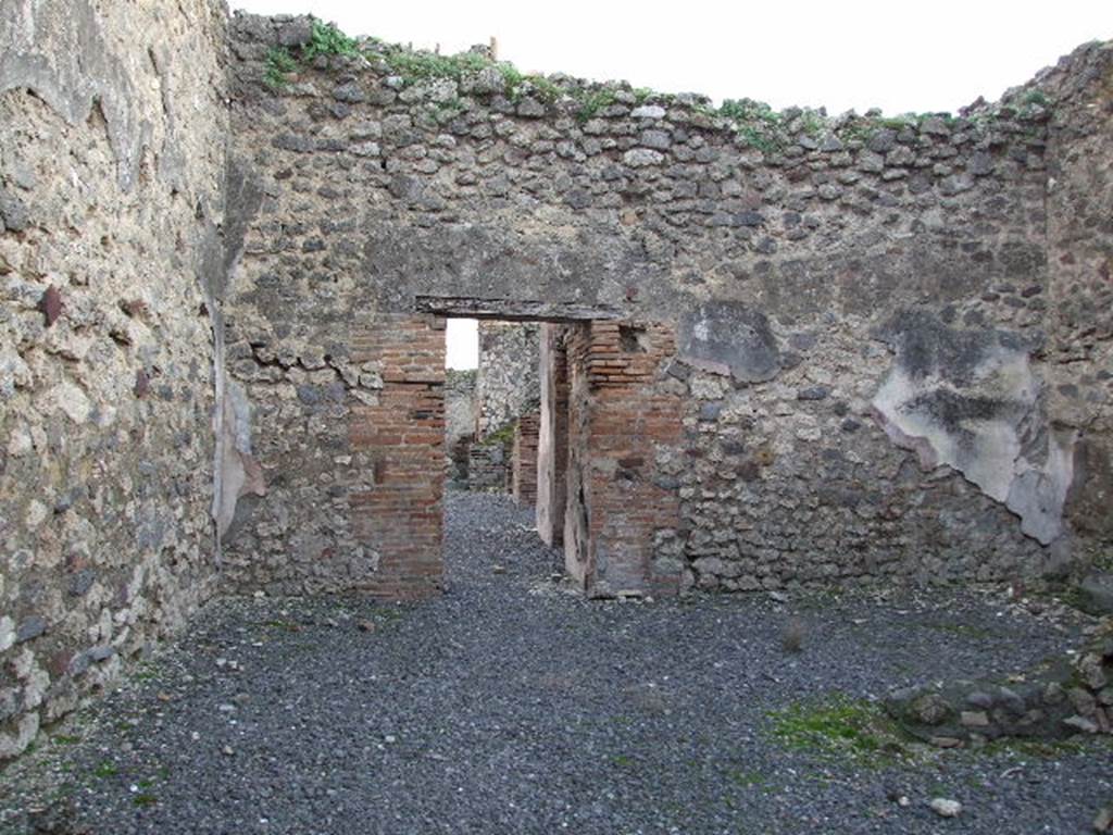 VII.1.37 Pompeii. December 2006. Line of staircase is visible on south wall, and doorway to bakery.