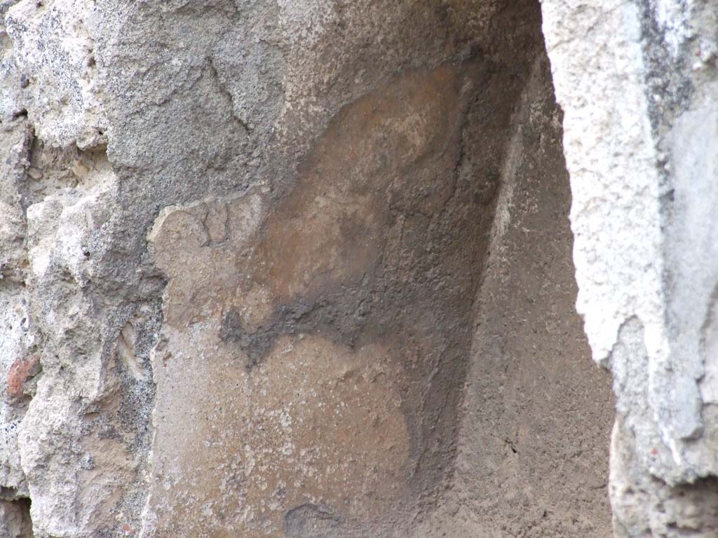 VII.1.39 Pompeii. December 2006. Detail of niche.
According to Boyce, apart from the above niche, there are also another two arched niches in a rear room.
One of the niches is partially blocked by the south wall of the room. 
These have not yet been seen by us, but were photographed by Stanley & Wilhelmina Jashemski, (below).
See Boyce G. K., 1937. Corpus of the Lararia of Pompeii. Rome: MAAR 14. (p. 61). 
