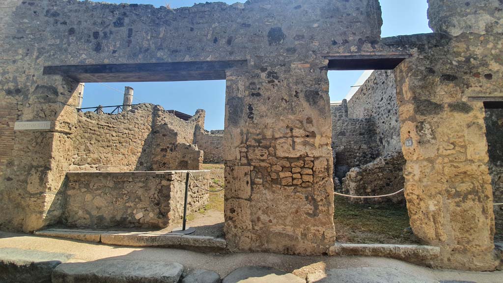 VII.1.44, on left, and VII.1.45, on right, Pompeii. July 2021. 
Looking towards entrance doorways on east side of Vicolo del Lupanare.
Foto Annette Haug, ERC Grant 681269 DCOR.
