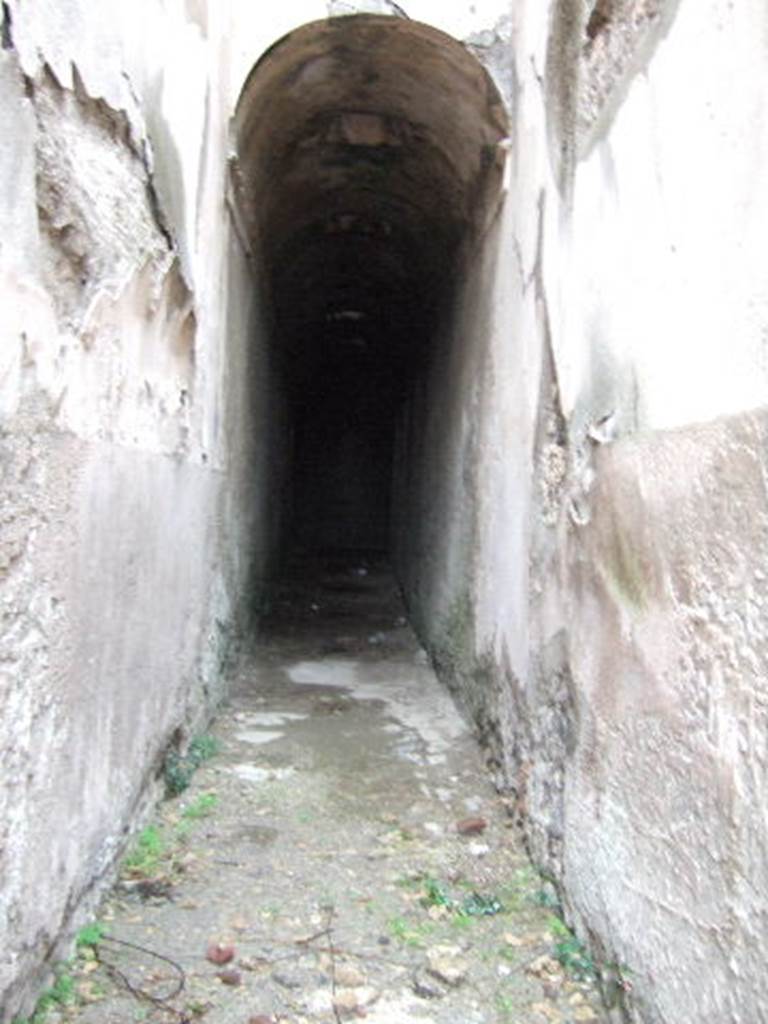 VII.1.48 Pompeii. December 2005. Looking east along corridor K. This leads to apodyterium (changing room) 11 of the womens baths.