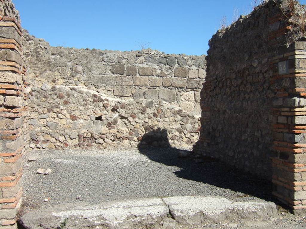 VII.1.54 Pompeii. September 2005.  Entrance of shop, looking east.