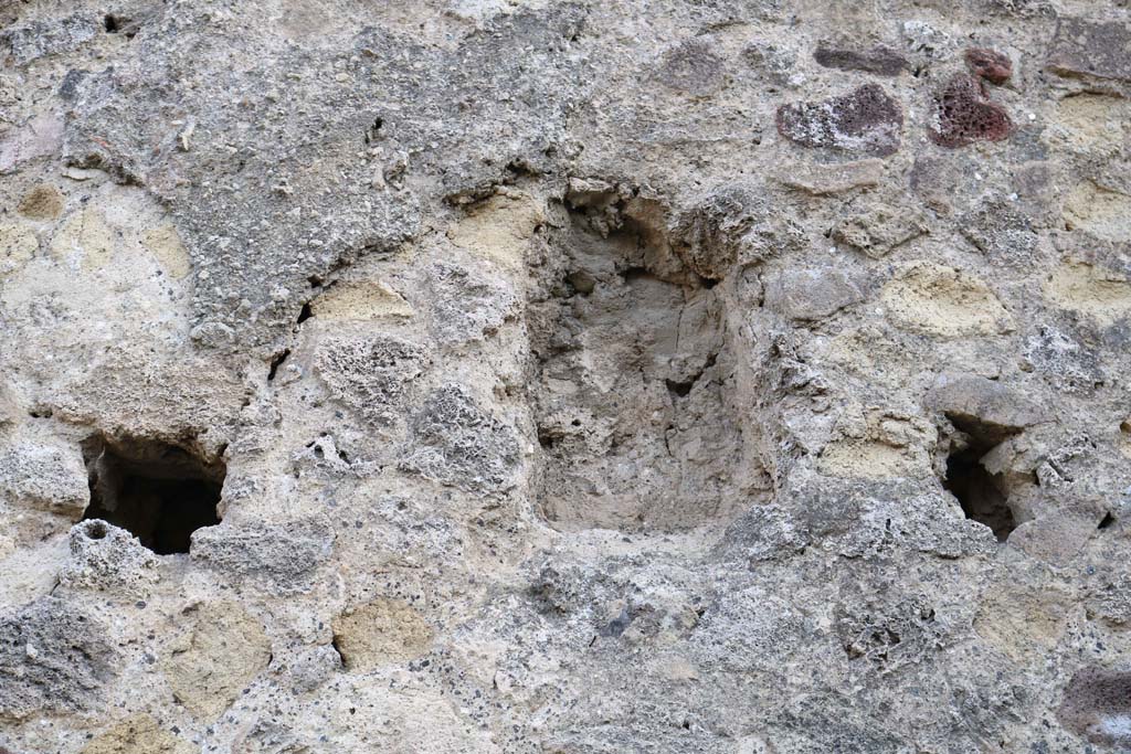 Rear of VII.1.57, Pompeii. December 2018.
East wall (?of Stabian Baths) with recess set into wall at level of the support beams for an upper floor.  
There appears to be another at the south end of the east wall in the south-east corner near the masonry arch. Photo courtesy of Aude Durand.


