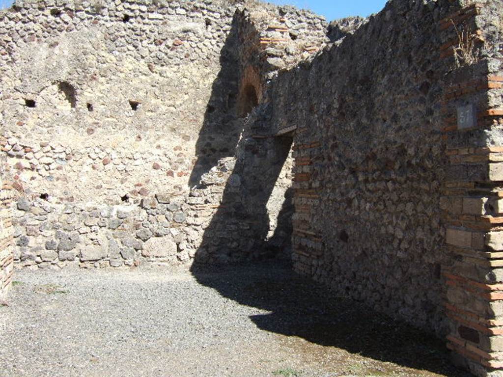 VII.1.57 Pompeii. September 2005. Looking east across shop.