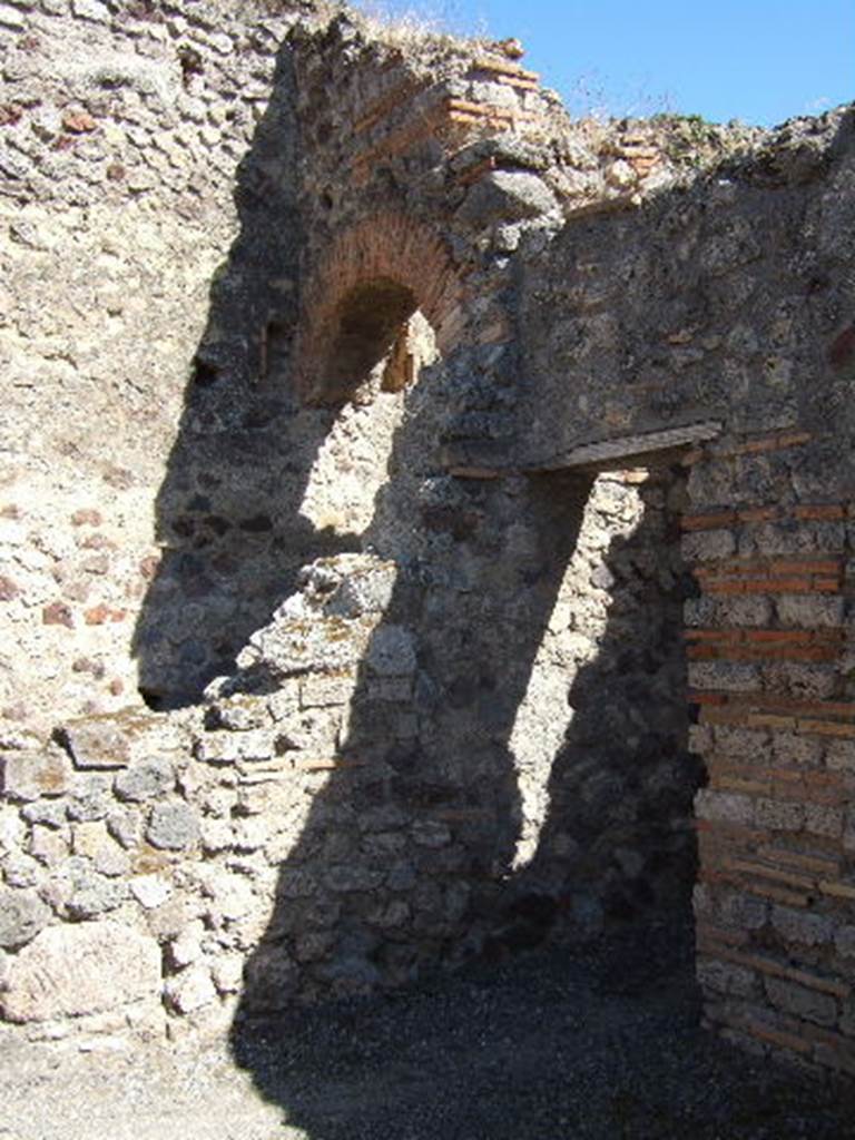 VII.1.57 Pompeii. September 2005. South wall of shop, with doorway to VII.1.58.