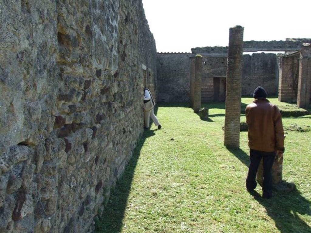 VII.2.18 Pompeii. March 2009. Looking south along east portico of peristyle garden. According to Fiorelli, painted in red on the end of the wall on the left of the peristyle, was
C. VIVI
ITALI     (Zangmeister  n. 2953)
See Pappalardo, U., 2001. La Descrizione di Pompei per Giuseppe Fiorelli (1875). Napoli: Massa Editore. (p.82)
According to Della Corte, found in the peristyle was
C. Vivi  Itali  P(h)rynis  (servus)     [CIL IV 2953]
See Della Corte, M., 1965.  Case ed Abitanti di Pompei. Napoli: Fausto Fiorentino. (p. 153-4)

