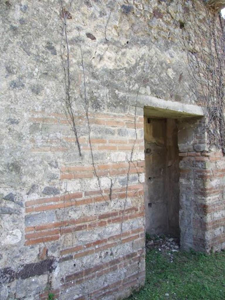 VII.2.18 Pompeii.  March 2009.  Doorway to Room 16. Cupboard.