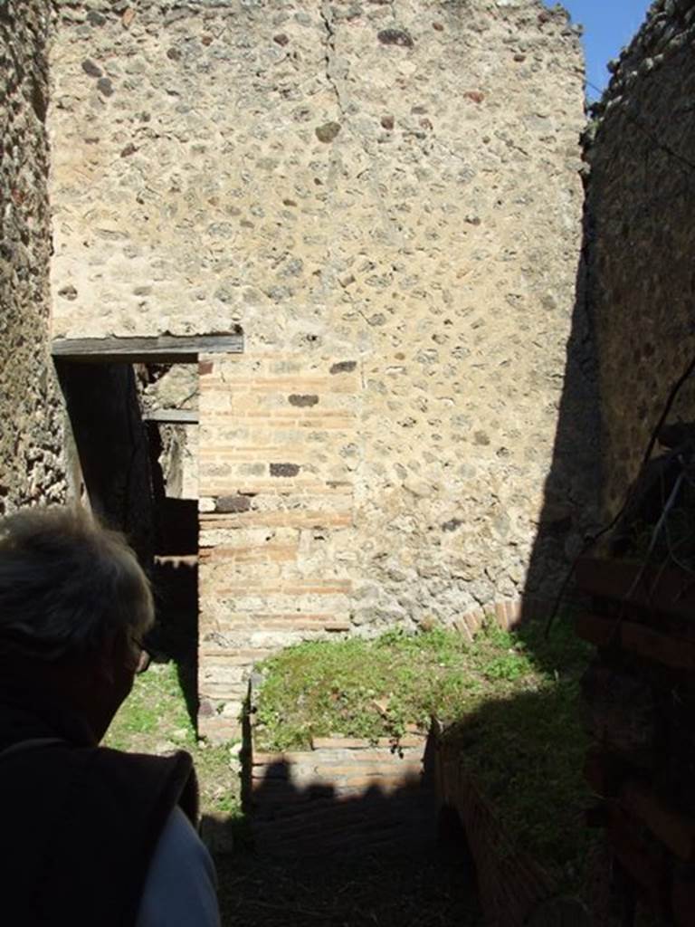 VII.2.18 Pompeii.  March 2009.  Room 19,  Kitchen.  North wall and corridor to peristyle.