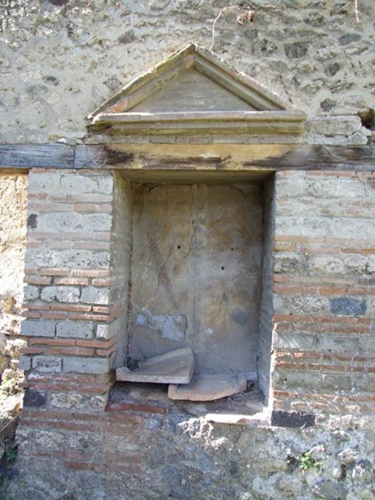 VII.2.18 Pompeii.  March 2009.  Aedicula Lararium, on west wall of Peristyle.