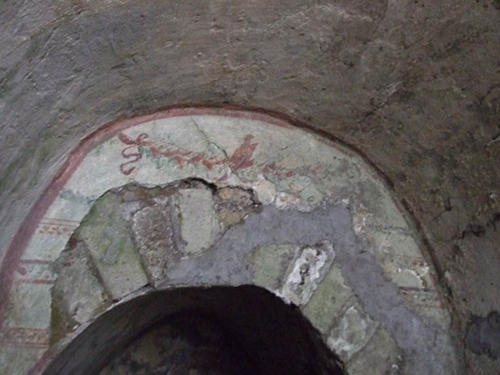 VII.2.20 Pompeii. December 2007. Painted garland above the offset doorway to the sacellum.  