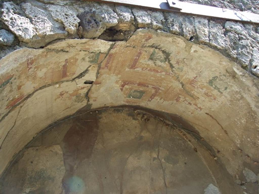 VII.2.20 Pompeii. March 2009. Painted plaster on arch in recess in north end of east wall.