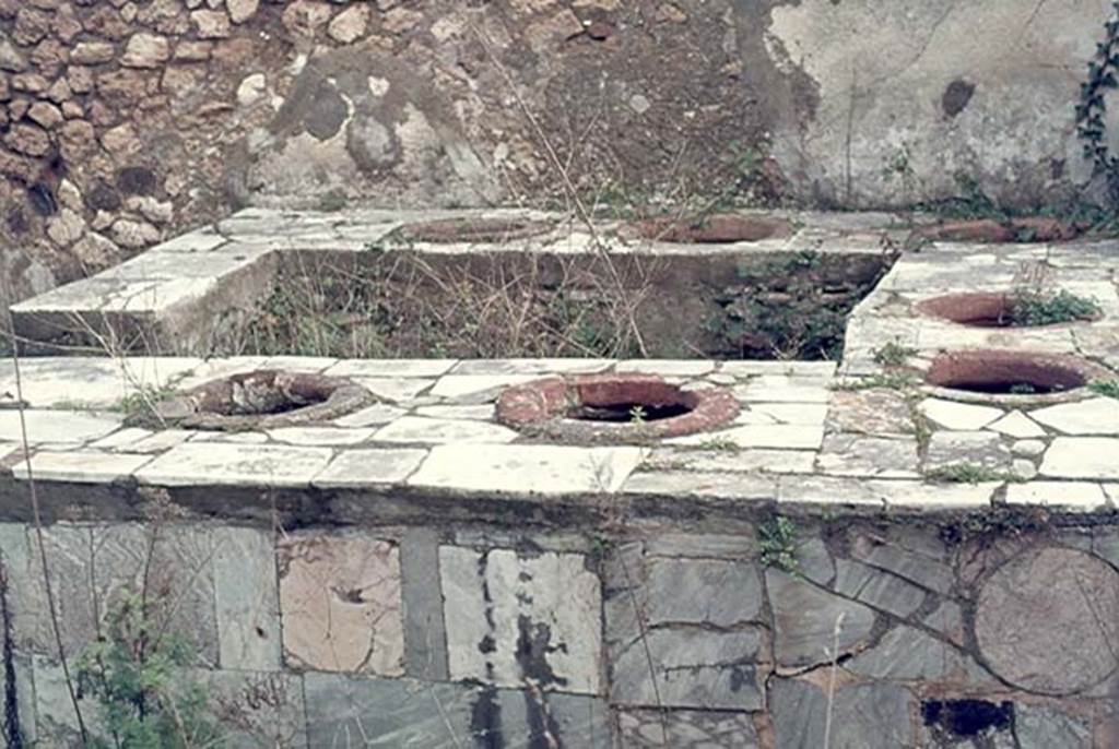 VII.2.32 Pompeii. January 1977. Looking east across marble clad counter. Photo courtesy of David Hingston.
