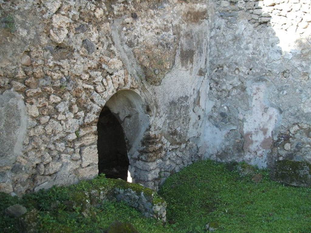 VII.2.41 Pompeii. May 2006. West wall with entrance to cellar.