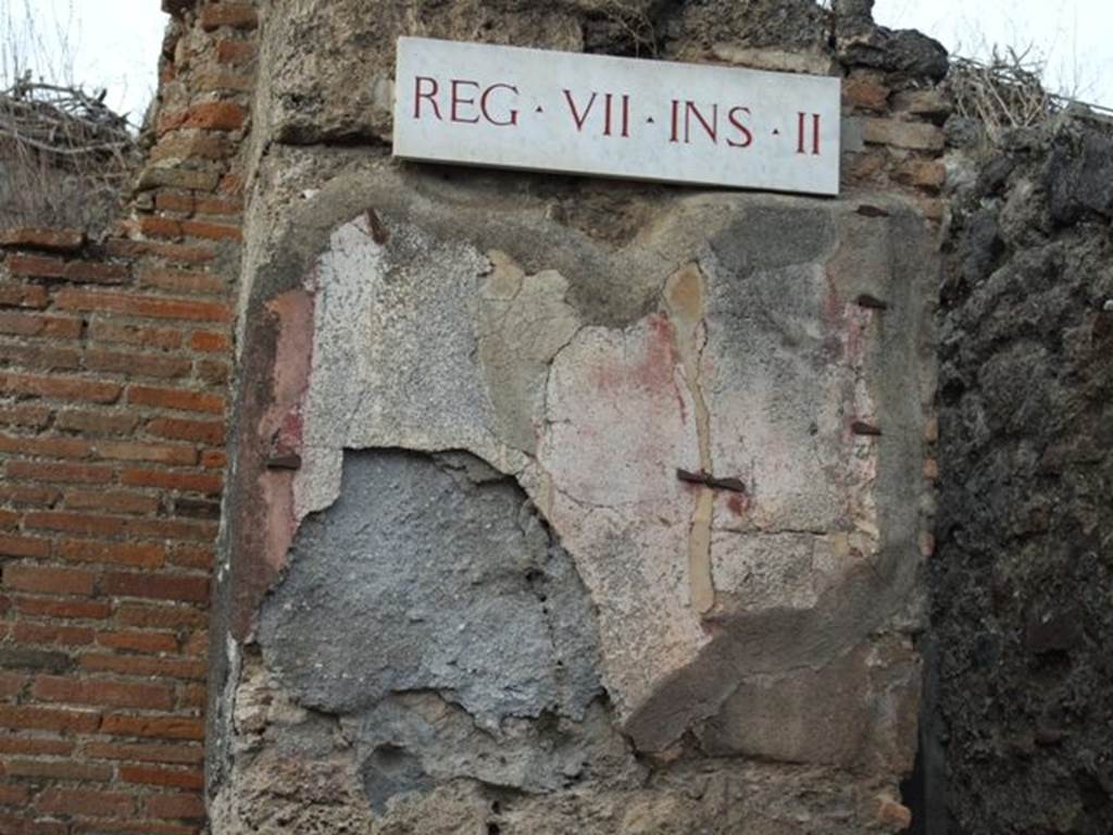 VII.2.47 Pompeii. December 2007. Painted plaster on wall on west side of entrance.