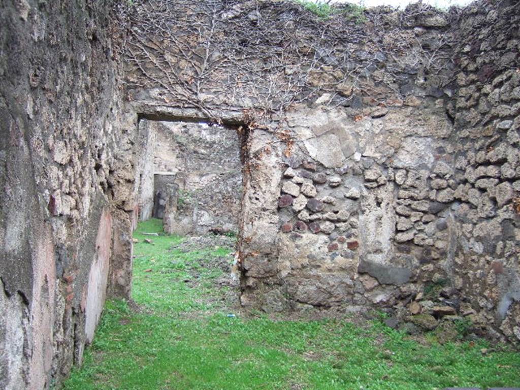 VII.2.49 Pompeii. December 2005. Looking north across shop to doorway in rear wall to atrium of VII.2.48.