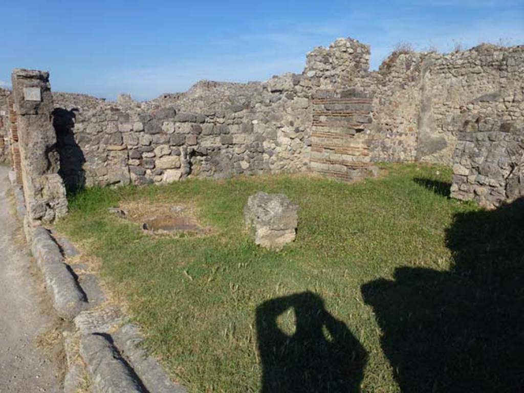 VII.3.4 Pompeii. June 2012.  Looking towards east side of shop, across site of counter, with remains of 3 urns. Photo courtesy of Michael Binns.
