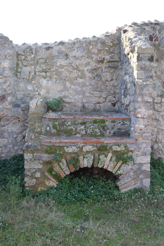 VII.3.9, Pompeii. December 2018. 
Looking west towards hearth or oven against west wall. Photo courtesy of Aude Durand.
