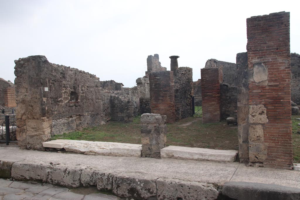 VII.3.12 on left and VII.3.11, on right, Pompeii. October 2023.
Looking south to both entrance doorways.  Photo courtesy of Klaus Heese.
