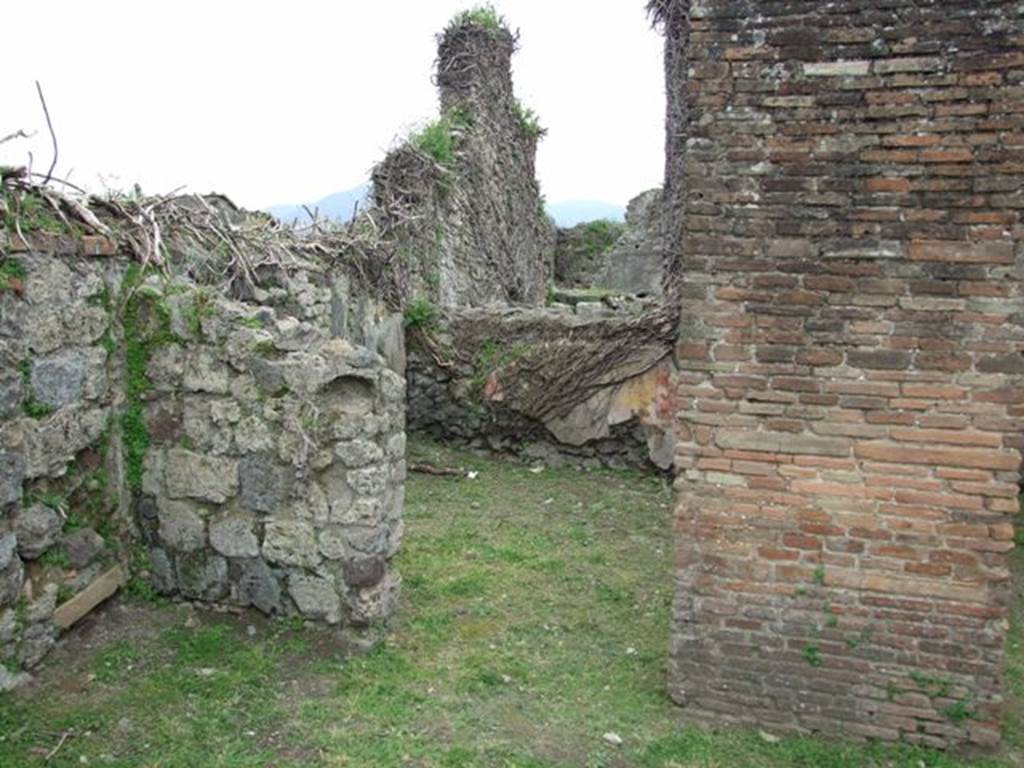 VII.3.12 Pompeii.  March 2009. Doorway to rear room of shop. 