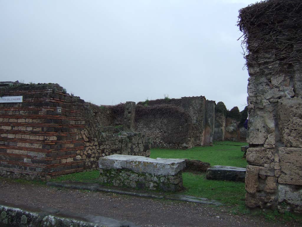 VII.3.13 Pompeii. December 2005. Wide shop entrance with marble podium.