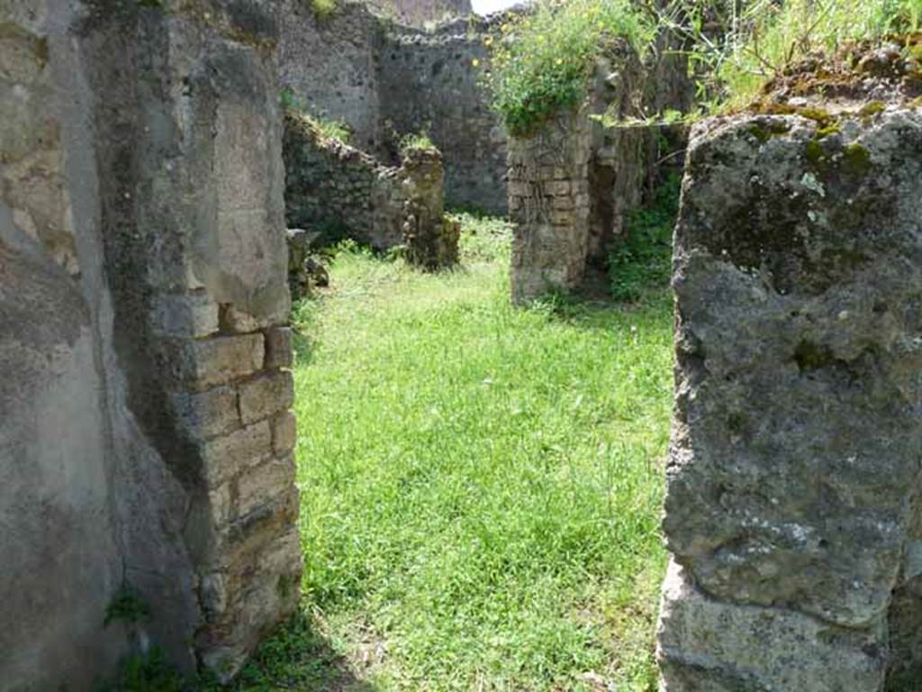 VII.3.22 Pompeii. May 2010. Doorway to small atrium, and VII.3.21.