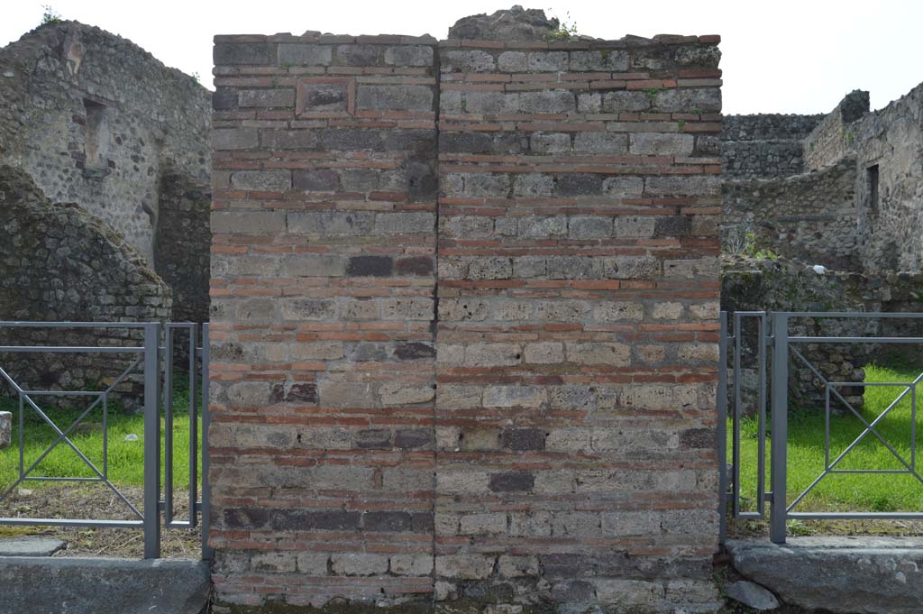 VII.3.23 Pompeii, on left. March 2018. Looking west towards pilaster on north side of entrance doorway showing plaque with phallus.
Foto Taylor Lauritsen, ERC Grant 681269 DCOR.
