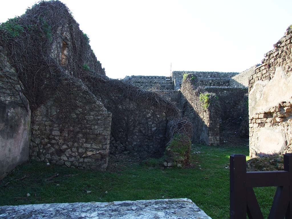 VII.3.23 Pompeii. December 2006. West wall of shop, with rear room and entrance to small atrium.