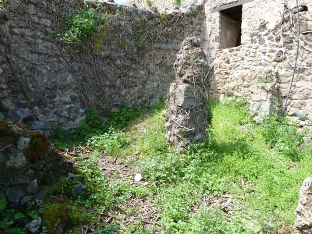 VII.3.23 Pompeii. May 2010. Rear of house in the north-west corner. On the left was the site of the kitchen, on the right was a small open yard, or light-well. 