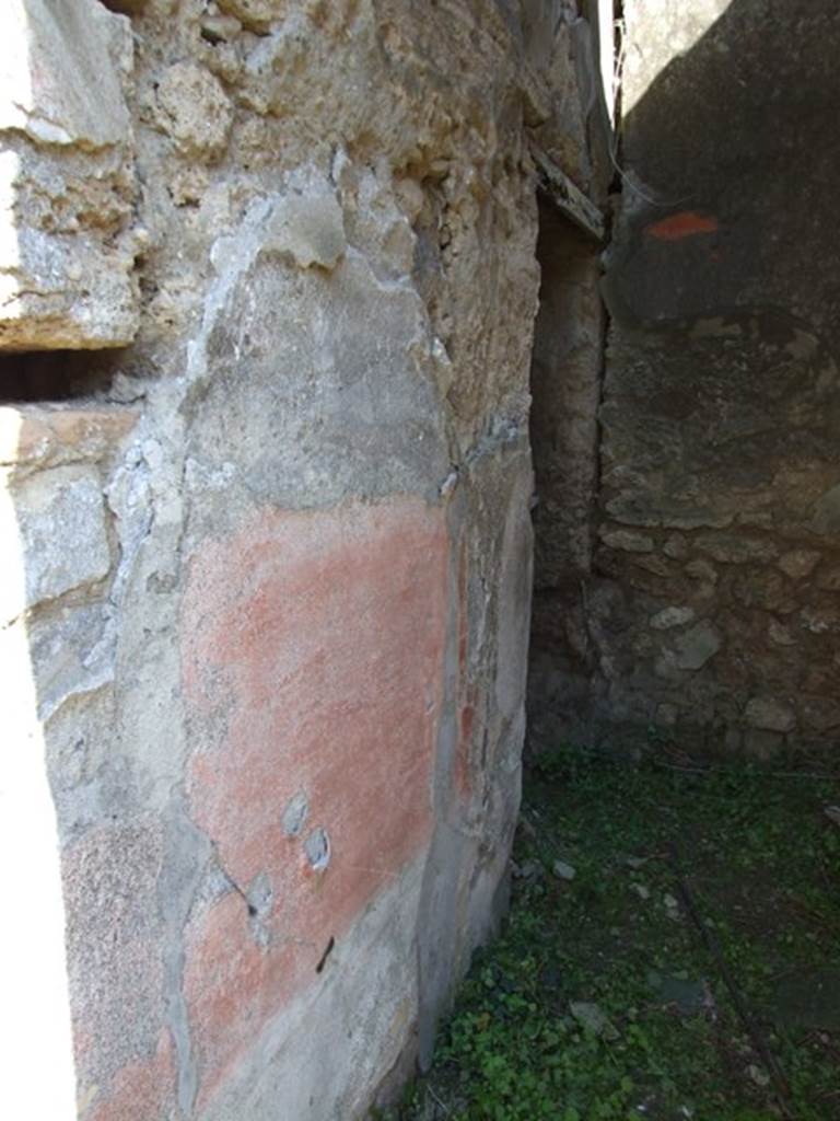 VII.3.29 Pompeii. March 2009. Room 12, north wall of corridor with doorway to garden area (no access). In this area were also an exedra or triclinium, another triclinium with window onto the garden and a niche shrine. According to Richardson, the best rooms of the house were a pair of dining rooms opening onto a small garden. These opened off a small square area that contained the lararium niche. The triclinium opened directly to the garden by  a large window with a low sill and had fine black and red decoration. The decoration was once very fine with large paintings in the centre panels, and delicate architecture in the upper zone.  Only ruins of this now remain but drawings were made of it when it was freshly excavated. Two paintings were taken to Naples Museum, inventory numbers 120085 and 120086. See Sogliano, A., 1879. Le pitture murali campane scoverte negli anni 1867-79. Napoli: (p. 101 no: 548  120085, and p.126 no: 616  120086)  See Richardson, L., 1988. Pompeii: an Architectural History. Baltimore: John Hopkins University Press. (p. 222-3)
