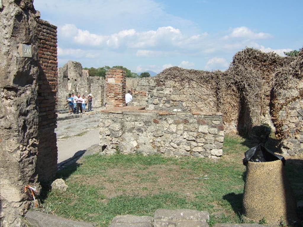 VII.3.40 Pompeii. September 2005. Entrance. According to Della Corte, between the doorways of VII.3.39 and VII.3.40, was written a curious painted graffito. He thought it was written not much after the year 80BC.

Quintio(m)  si  qui  recusant  assidat  ad  asinum      [CIL IV 2887] 

Della Corte translated this as,Chi rifiuta Quinzio, (o gli e contro nellelezione), merita la pubblica fustigazione a dorso dasino
This roughly translates as Who refuses Quinzio (or is against in the election), deserves the public flogging on a donkeys back.
See Della Corte, M., 1965.  Case ed Abitanti di Pompei. Napoli: Fausto Fiorentino. (p. 125)

According to Fiorelli, at the end of the vicolo near these doorways, there were various painted graffiti. Two of them were

SALINESIBVS . FELICITER

IVDICIS . AVG . FELIC 

The latter was painted in red letters on the upper part of the wall.  Also inscribed in big letters was the word  ROMA.
See Pappalardo, U., 2001. La Descrizione di Pompei per Giuseppe Fiorelli (1875). Napoli: Massa Editore. (p. 88)
