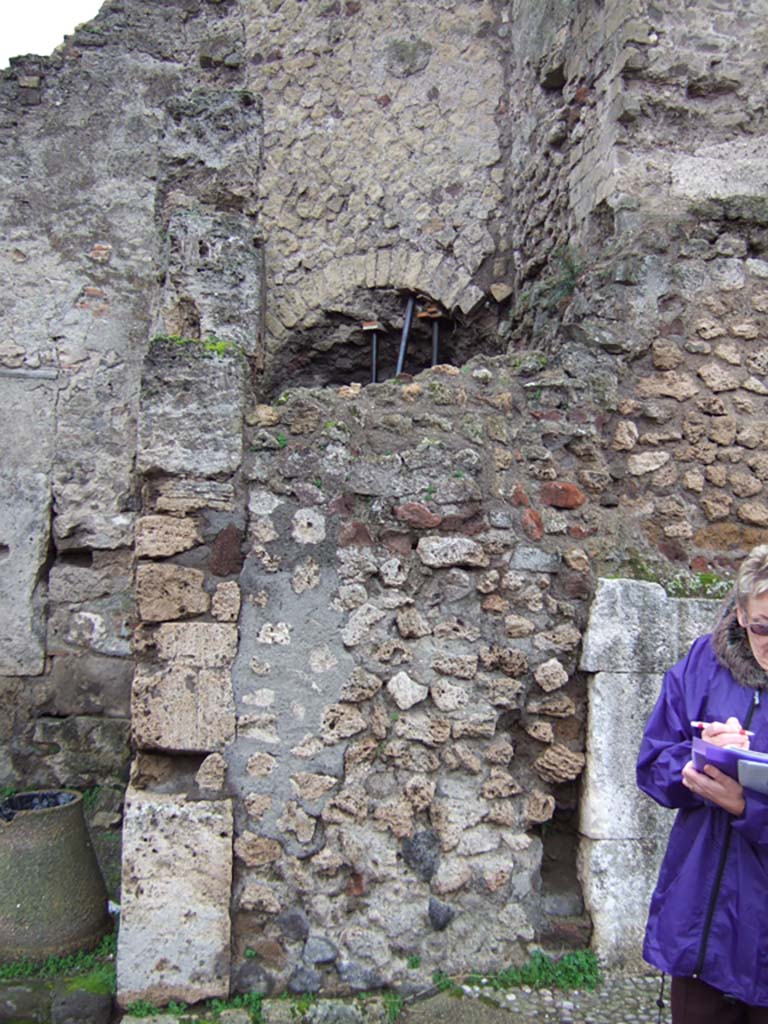 VII.4.1 Pompeii. December 2005. Looking south to blocked doorway in exterior side wall on Via della Fortuna.