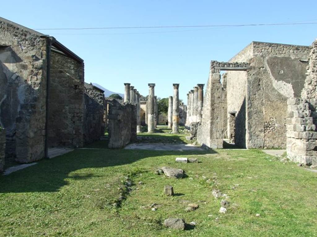 VII.4.31 Pompeii. March 2009. Room 2, atrium with remains of impluvium.  
Looking north, through two peristyles to other entrance in Via della Fortuna.
