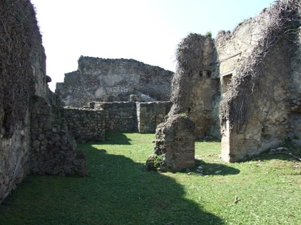 VII.4.39 Pompeii. March 2009. Looking west across shop towards rear room.