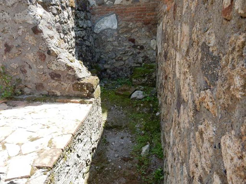 VII.4.48 Pompeii. May 2015. Room 7, looking south to latrine in kitchen area.
Photo courtesy of Buzz Ferebee.
