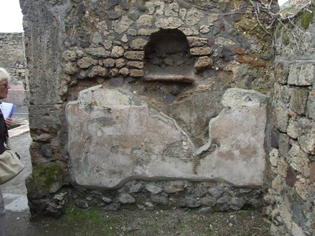 VII.4.48 Pompeii. March 2009. Room 9, north wall with arched niche with tile shelf. See Boyce G. K., 1937. Corpus of the Lararia of Pompeii. Rome: MAAR 14. (p.66, no.275) 
