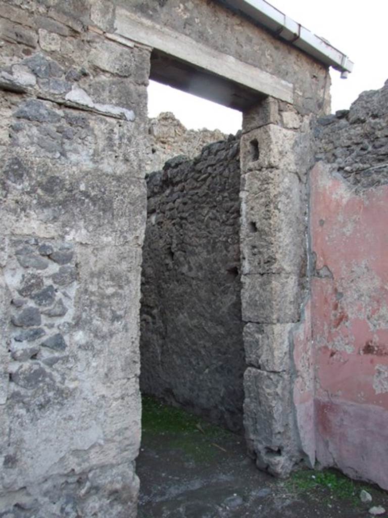 VII.4.48 Pompeii. December 2007. Doorway to room 15.   On the atrium west wall dividing room 14 from 15, on the left in this picture, a painted figure of Autumn was seen.  On the atrium north wall, on the right, a painted figure of Winter was seen.
See Bragantini, de Vos, Badoni, 1986. Pitture e Pavimenti di Pompei, Parte 3. Rome: ICCD. (p.130, atrio (2))
