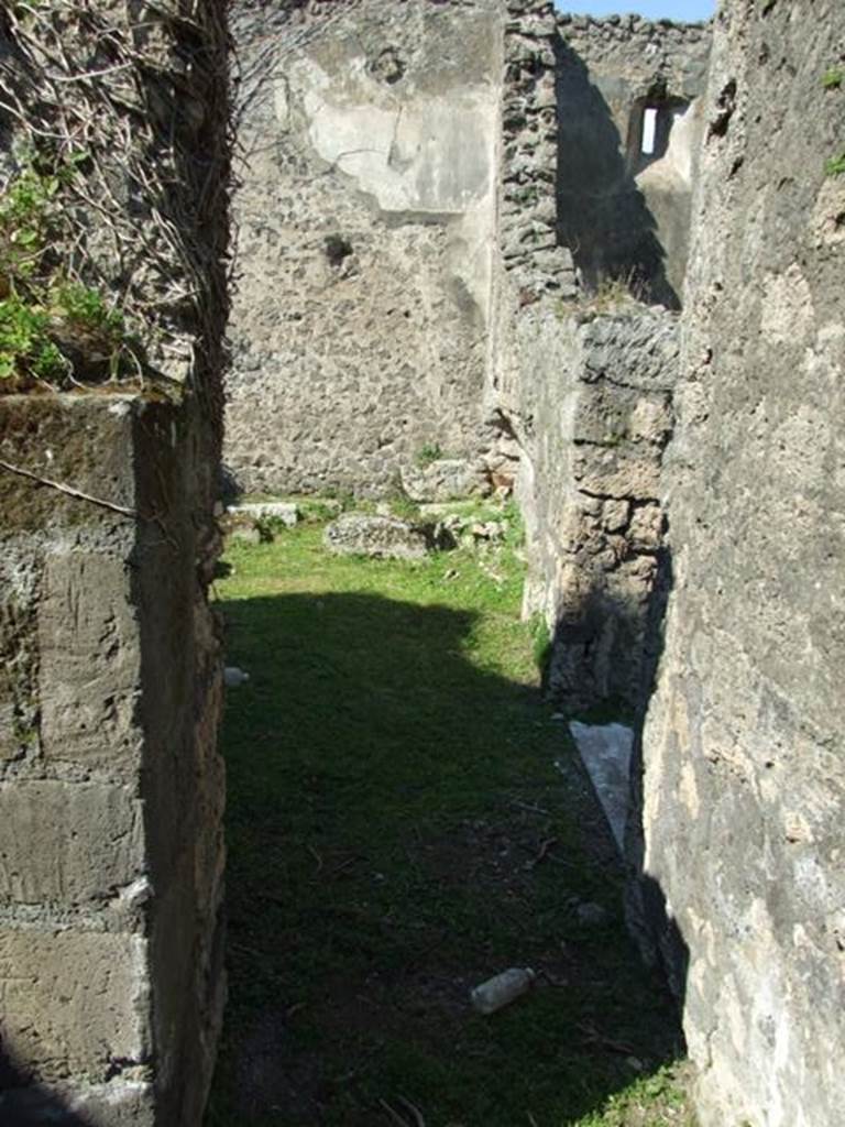 VII.4.57. Pompeii.  March 2009.  Room 11.  Cubiculum. North wall, with small doorway to Room 12.