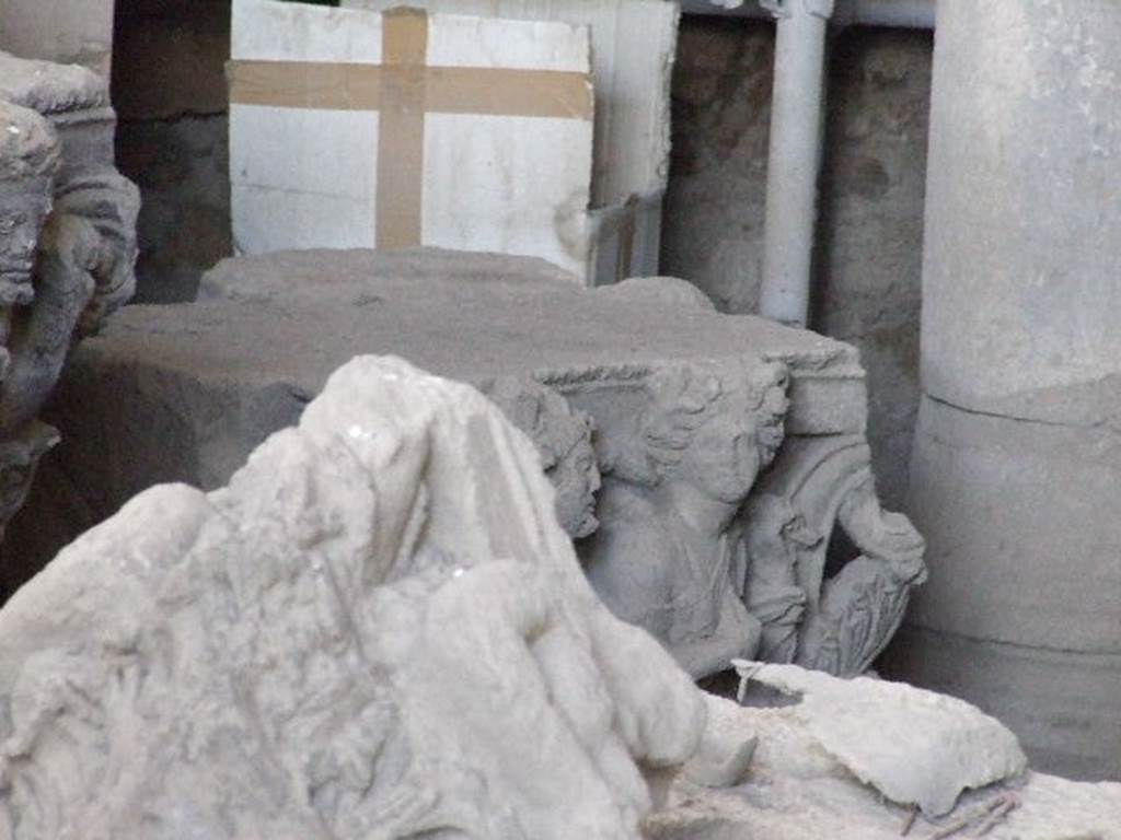 VII.4.57 Pompeii. December 2006, on display in Forum Granaio at VII.7.29. 
Satyr (background) pursuing a maenad on a capital. This faced the Via della Fortuna on the top of left-hand side of entrance.



