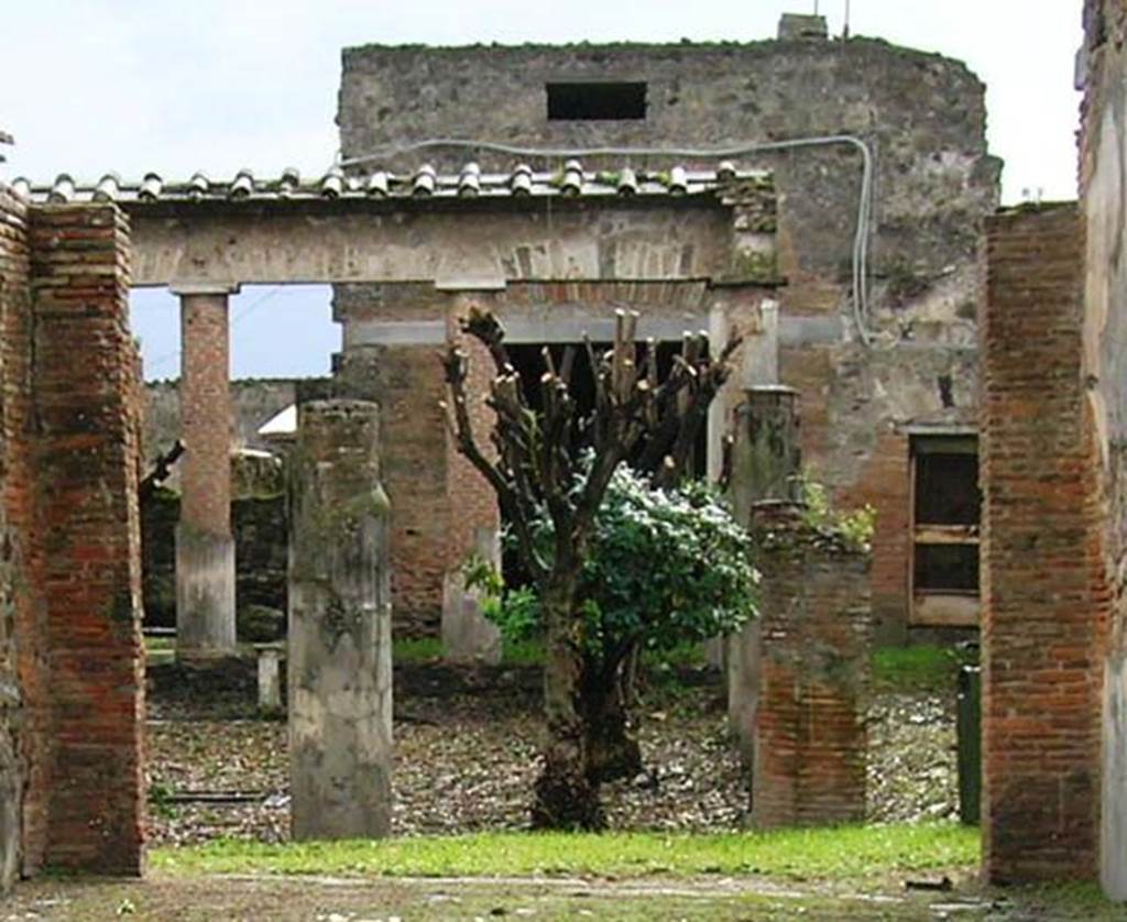 VII.4.59 Pompeii. November 2012. Looking across peristyle o to exedra or triclinium y (behind the trees). Detail from photo in Wikimedia, courtesy of author Mentnafunangann. 
Use subject to a Creative Commons Attribution-Share Alike 3.0 Unported Licence.
