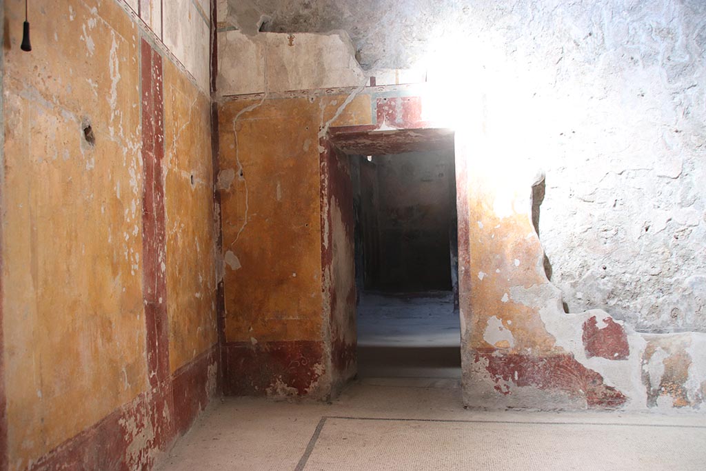 VII.5.8 Pompeii. October 2024. Tepidarium (49), doorway into room 46, changing room, in north wall. Photo courtesy of Klaus Heese.