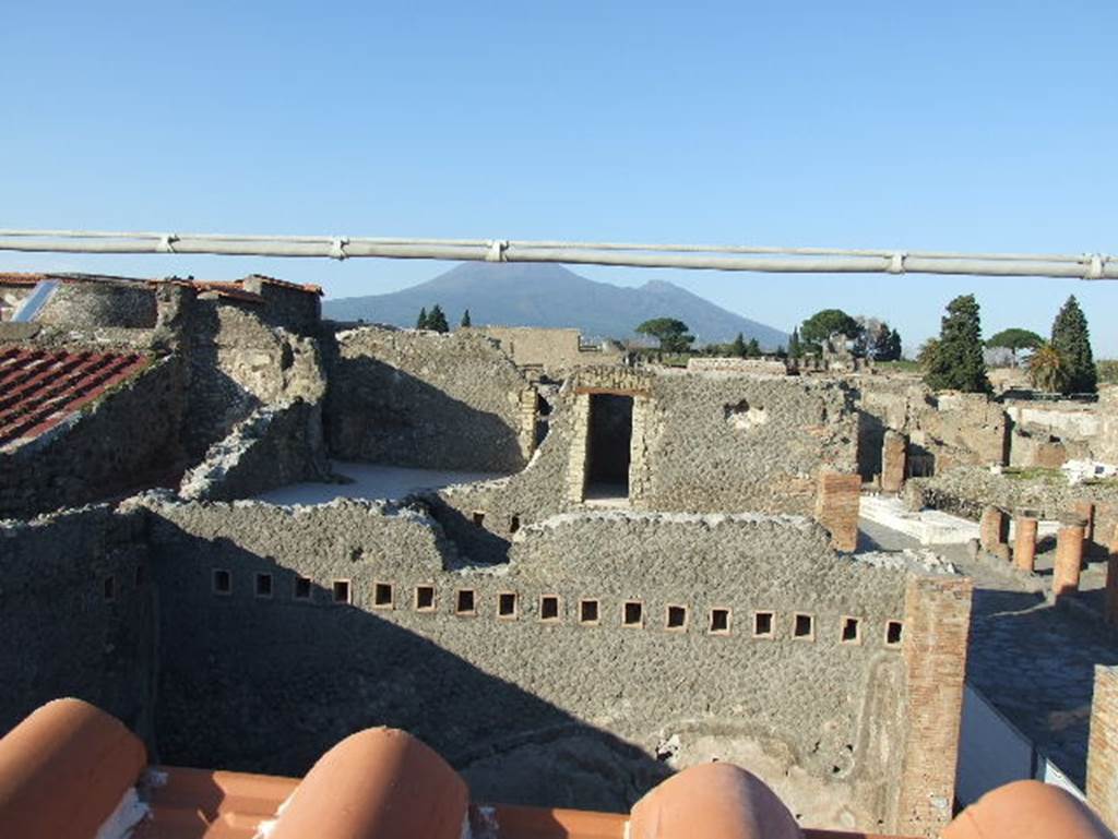 VII.5.19 Pompeii. December 2007. 
View looking north across Forum Baths to Vesuvius from roof of new restaurant.
According to Fiorelli, the west side of the insula contained a number of large shops with an upper floor, between them was the entrance to the Forum Baths. Although the shops did not have any particular merit to their construction, many rich objects were found some of which fell from the upper floors. See Pappalardo, U., 2001. La Descrizione di Pompei per Giuseppe Fiorelli (1875). Napoli: Massa Editore. (p.96)

