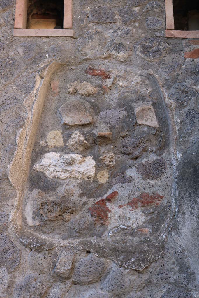 VII.5.22, Pompeii. December 2018. 
Filled-in niche in west wall, below holes for support beams for an upper floor.
Photo courtesy of Aude Durand.
