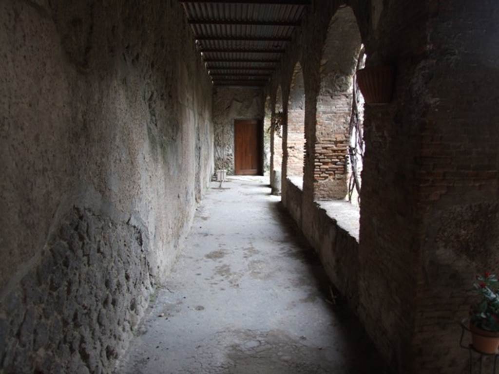 VII.5.24 Pompeii. March 2009.  Looking south along East Portico of Courtyard, with brick pillars and arches.