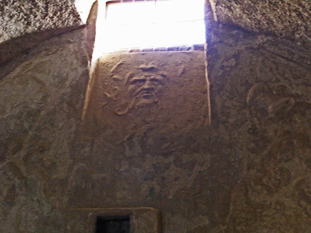 VII.5.24 Pompeii. November 2010. Changing room (14), south wall with stucco mask of Oceanus beneath window.