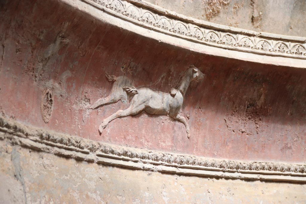 VII.5.24 Pompeii. May 2024. Frigidarium, detail of plasterwork showing a cupid on a two-horse chariot. Photo courtesy of Klaus Heese.