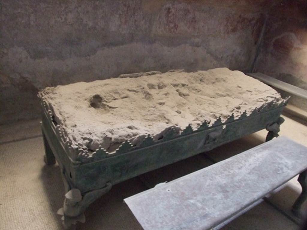 VII.5.24 Pompeii. December 2007. Bronze brazier (38) in south end of tepidarium. During the mid-first century AD, Marcus Nigidius Vaccula donated 3 bronze benches and a bronze brazier heater to the Tepidarium. He also gave a similar bronze brazier to the Stabian Baths.
See Cooley, A. and M.G.L., 2004. Pompeii : A Sourcebook. London : Routledge. (p.81). See Berry, J., 2007. The Complete Pompeii. London: Thames & Hudson.  (p.152)